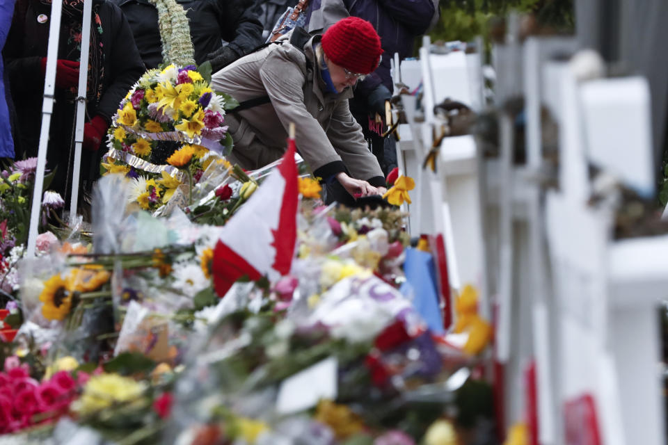 FILE - In this Saturday, Nov. 3, 2018 file photo, people place stones near the memorials outside the Tree of Life Synagogue after a service in Pittsburgh. Eleven people were killed and six others injured in a shooting during services there a week earlier. (AP Photo/Keith Srakocic)