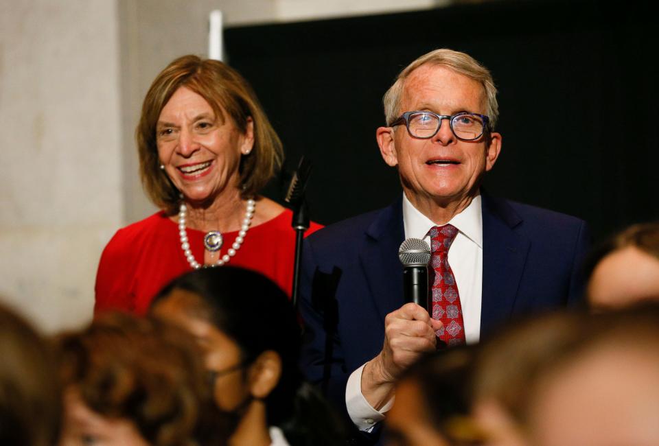 Governor Mike DeWine, right, speaks with Fran DeWine at the Statehouse Tree Lighting Ceremony during the Holiday Festival at the Ohio Statehouse in Columbus, Ohio, on Thursday, Dec. 2, 2021.