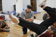 Gabriel “Kwikstep” Dionisio teaches at KBL studios Thursday, Aug. 22, 2019, in New York. Many in the breaking community are eager for the art form to expand its audience after the International Olympic Committee announced that it would become an official sport at the Paris 2024 games. But that optimism is hardly unanimous. (AP Photo/Frank Franklin II)