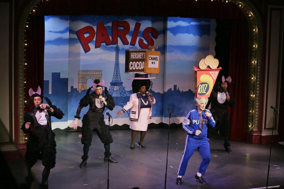 In this Wednesday, Dec. 4, 2019 photo, characters portraying French poodles, Coco Chanel and Vladimir Putin perform during the musical "Beach Blanket Babylon" in San Francisco. The campy small San Francisco show that's been a must-see for tourists and locals alike for more than 45 years, making it the nation's longest continuously running musical revue, is closing its curtain. Its final performance is set for New Year’s Eve. (AP Photo/Eric Risberg)