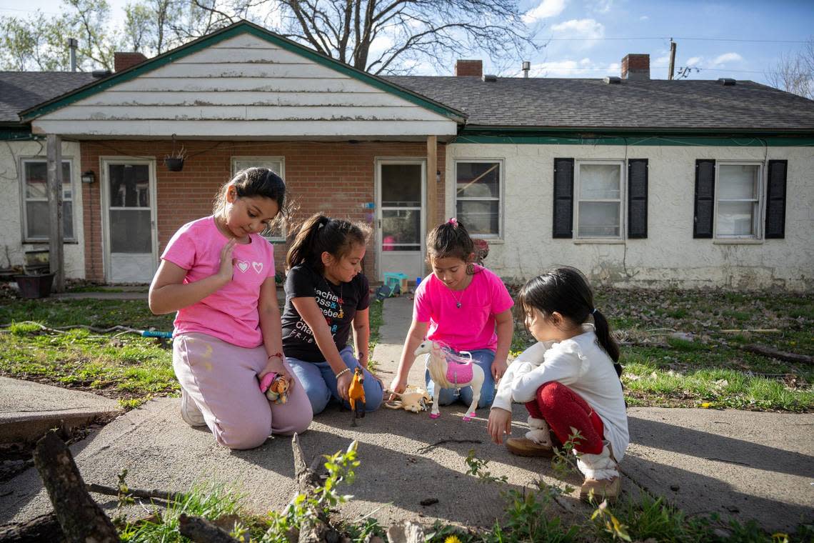 Neighborhood friends Abigail Carlos, 8, from left, Monse Villegas, 7, Kingslie Snell, 8, and Briana Zavala, 6, played together on a warm spring day outside their homes at Clearview Village.