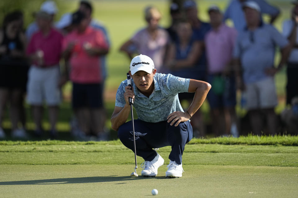 Collin Morikawa lines up a putt on the 17th green during the second round of the Tour Championship golf tournament, Friday, Aug. 25, 2023, in Atlanta. (AP Photo/Mike Stewart)