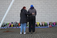 <p>Supporters looking at the tributes to the Leicester City owner after the horrifying crash. Aaron Chown/PA Wire </p>