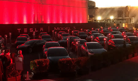 Tesla Model 3 cars wait for their new owners as they come off the Fremont factory's production line during an event at the company's facilities in Fremont, California, U.S., July 28, 2017. REUTERS/Alexandria Sage
