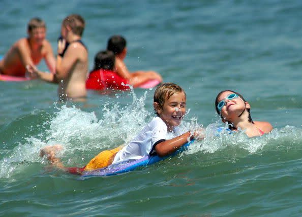 summer activities kids swimming in the ocean