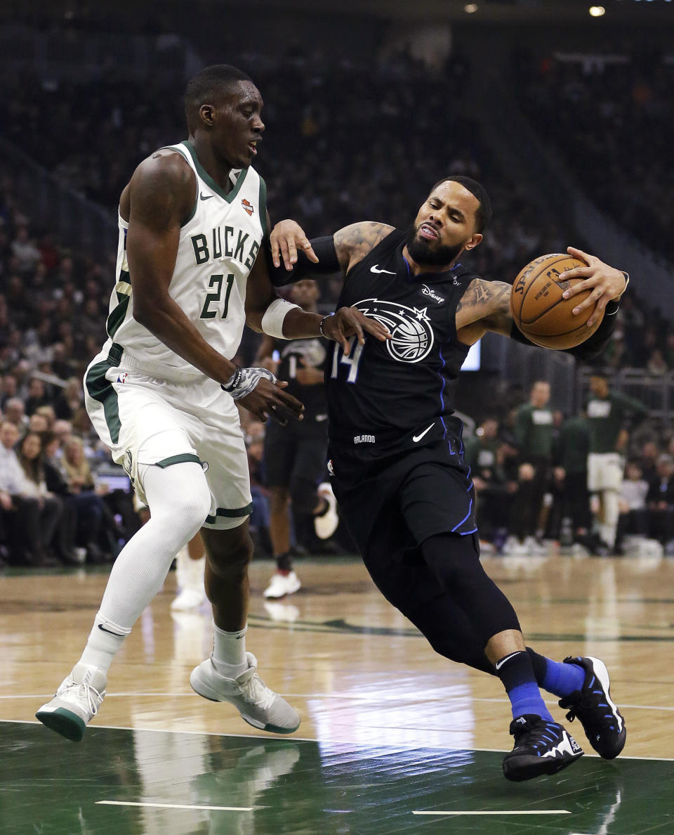 Orlando Magic's D.J. Augustin drives to the basket against Milwaukee Bucks' Tony Snell during the first half of an NBA basketball game Saturday, Feb. 9, 2019, in Milwaukee. (AP Photo/Aaron Gash)