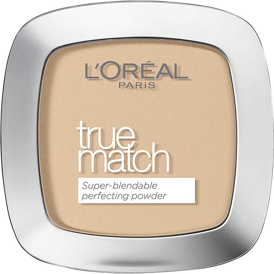 A silver compact of L'Oréal Paris True Match Cream Powder with a transparent window showing the beige powder with white, silver and black lettering. The compact sits on a white background.