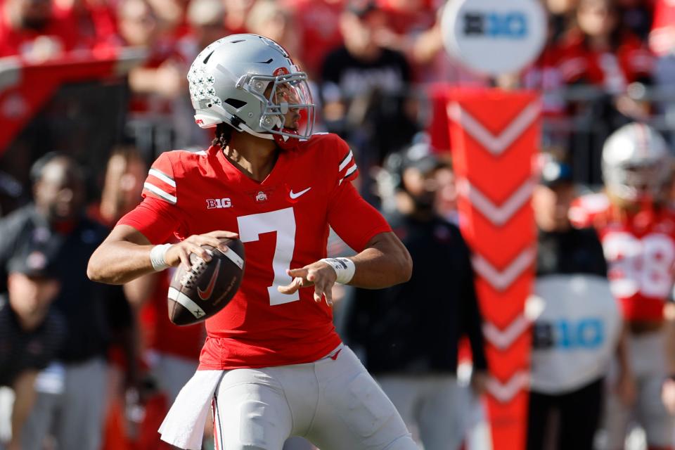 Ohio State quarterback C.J. Stroud throws a touchdown pass against Iowa during the second half of an NCAA college football game Saturday, Oct. 22, 2022, in Columbus, Ohio. (AP Photo/Jay LaPrete)