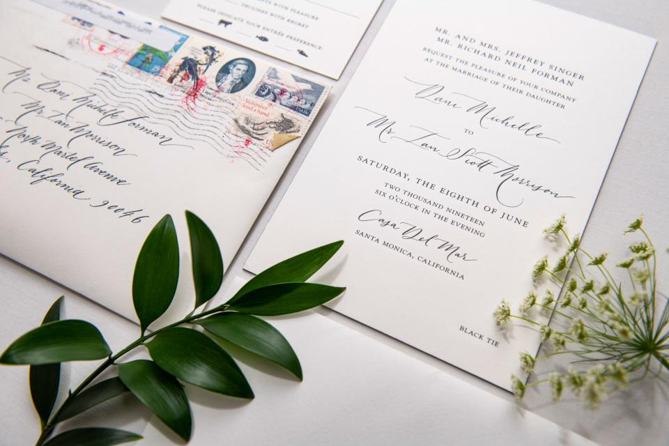 Our engraved letter press invitations with hand calligraphy and vintage stamps.