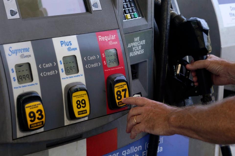 Consumers Inflation (A customer pumps gas at an Exxon gas station on May 10, 2022, in Miami, Florida)