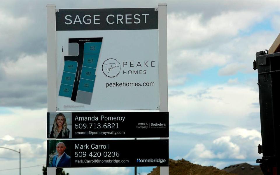 A sign illustrates the lots offered at the Sage Crest housing development by Peake Homes on South Nelson Street just off Ridgeline Drive in south Kennewick.