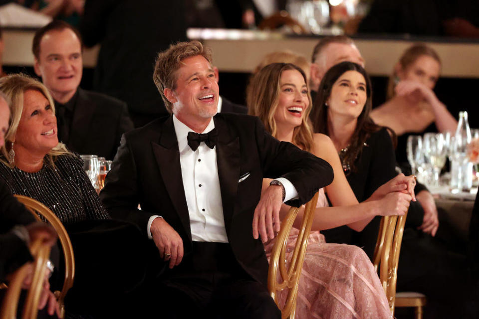 Quentin Tarantino, Brad Pitt, and Margot Robbie attend the 80th Annual Golden Globe Awards.