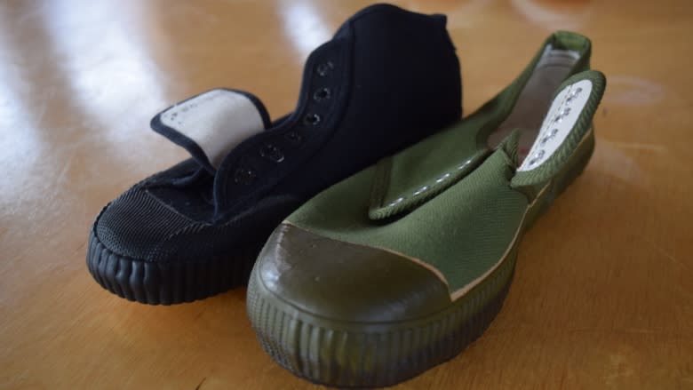 N.B. shoemaker tries to get China-inspired shoes off on right foot