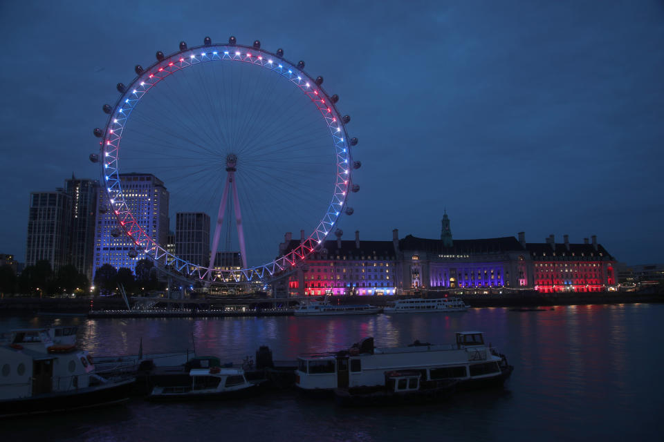 The London Eye turns red, white and blue in honour of the birth of a baby boy to the Duke and Duchess of Sussex. (Photo by Yui Mok/PA Images via Getty Images)