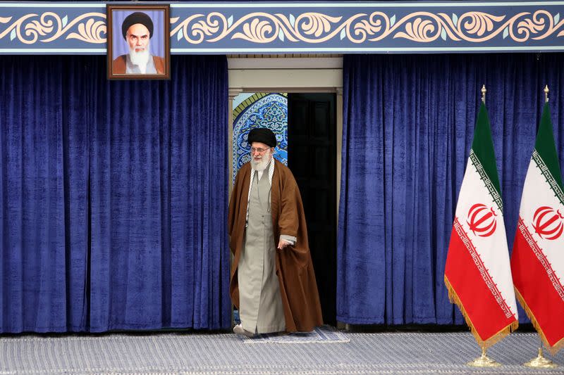 Iran's Supreme Leader Ayatollah Ali Khamenei arrives to cast his vote at a polling station during parliamentary elections in Tehran