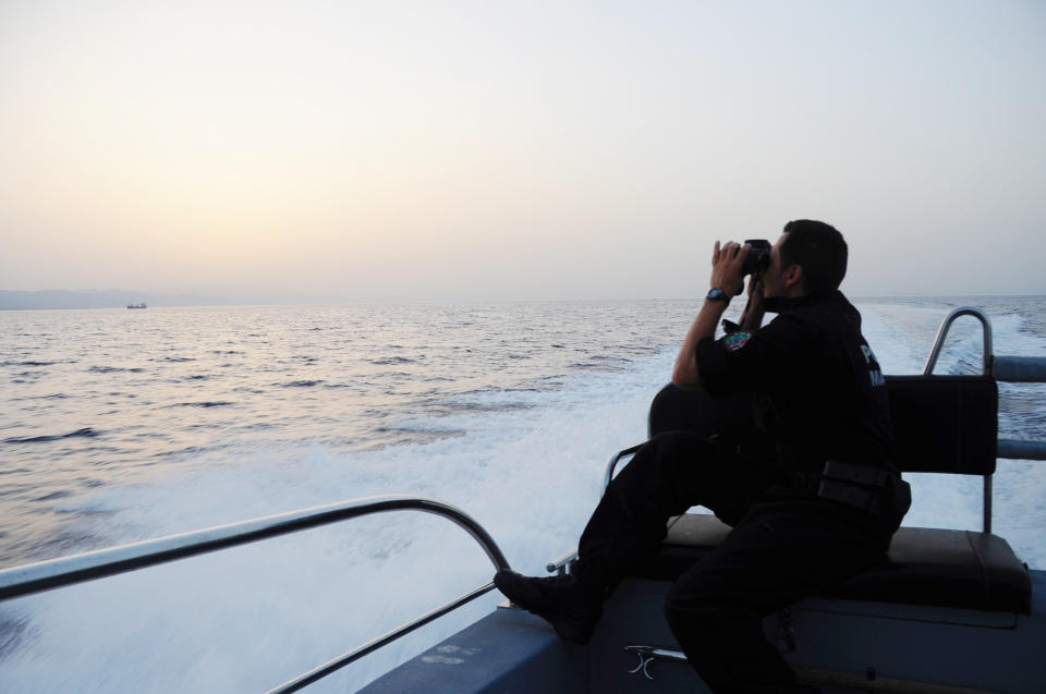 Ricardo Pereira seeks&nbsp;a better look at a boat spotted on the horizon to confirm it's a dinghy full of people in distress.