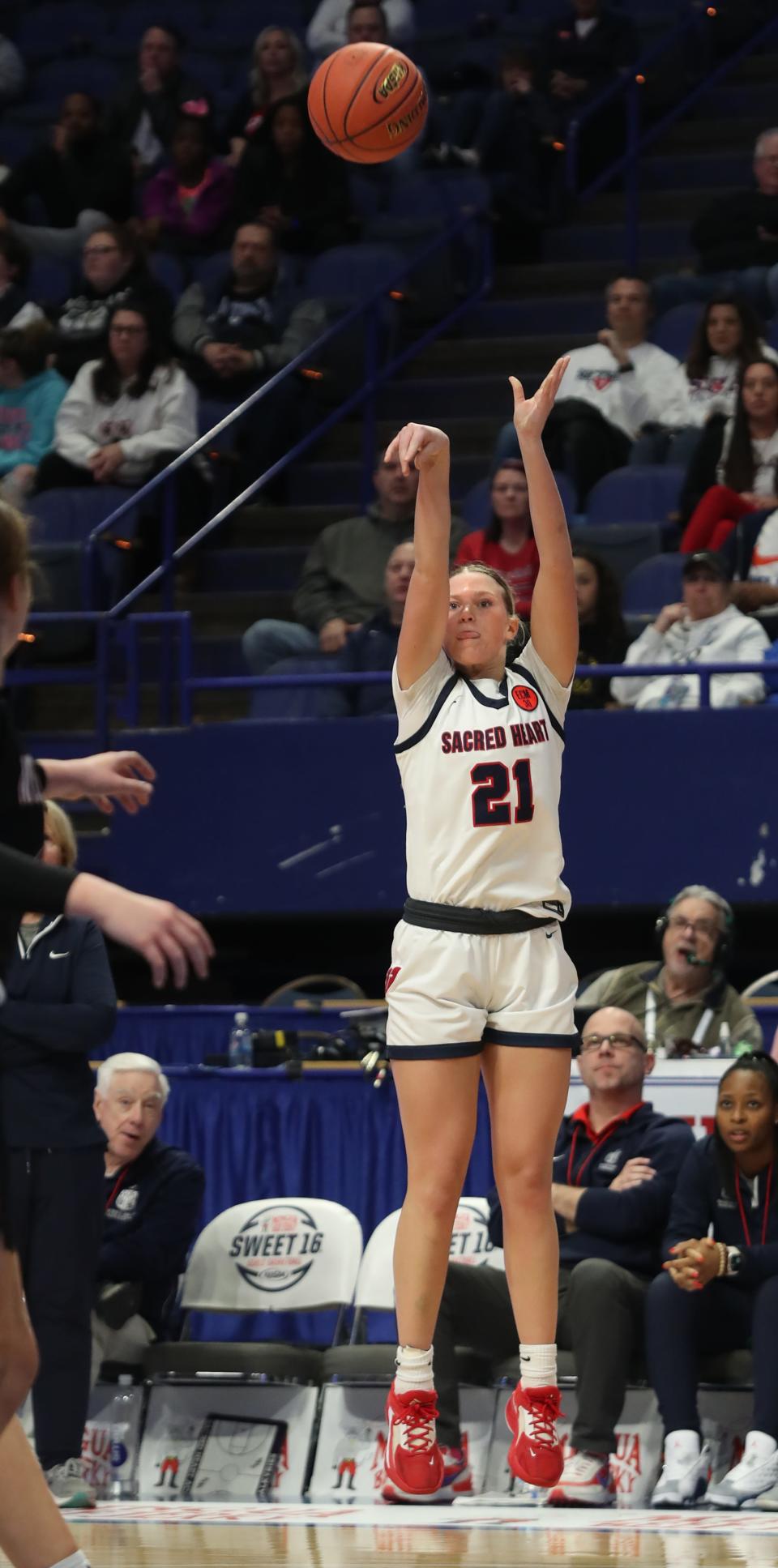 Sacred Heart’s Reagan Bender makes a three against McCracken in the 2023 Mingua Beef Jerky Girls’ Sweet 16.March 11, 2023