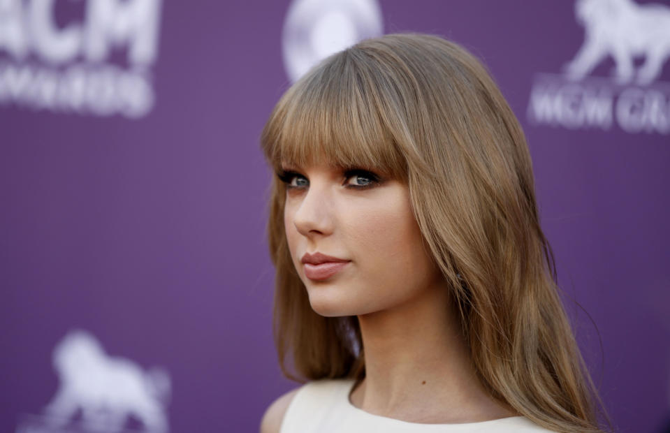 Taylor Swift arrives at the 47th Annual Academy of Country Music Awards on Sunday, April 1, 2012 in Las Vegas. (AP Photo/Isaac Brekken)