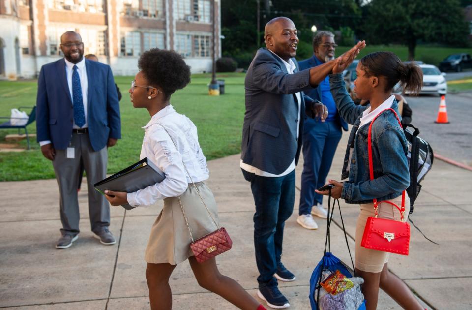 Charles Lee welcomes students at Lanier High School in Montgomery, Ala., on Wednesday, Sept. 14, 2022.