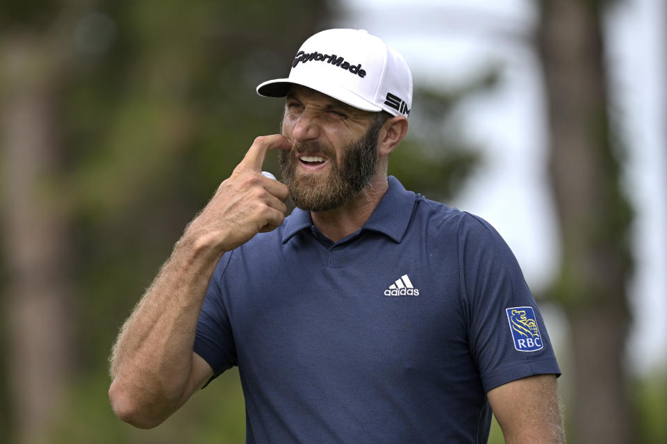 Dustin Johnson reacts after putting on the sixth green during the final round of the Valspar Championship golf tournament, Sunday, May 2, 2021, in Palm Harbor, Fla. (AP Photo/Phelan M. Ebenhack)