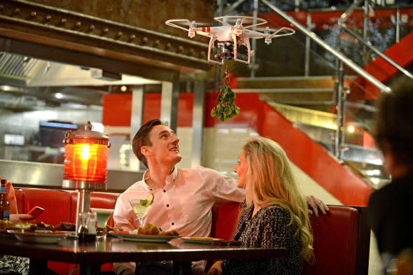 Restaurant launches 'mistletoe drones' to get couples to kiss