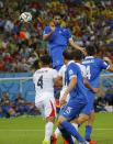 Greece's Giorgios Samaras (top) heads the ball during their 2014 World Cup round of 16 game against Costa Rica at the Pernambuco arena in Recife June 29, 2014. REUTERS/Brian Snyder