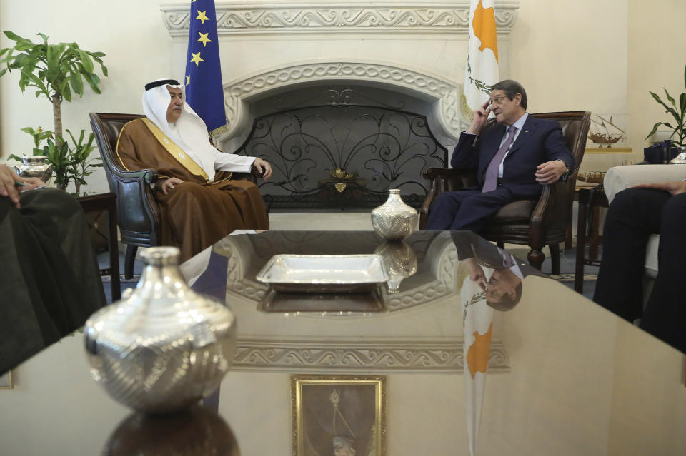 Cyprus' president Nicos Anastasiades, right, and Saudi Foreign Minister Ibrahim Bin Abdulaziz Al-Assaf talk during their meeting at the presidential palace in capital Nicosia, Cyprus, Wednesday Sept. 11, 2019. Al-Assaf is in Cyprus for talks. (AP Photo/Petros Karadjias)