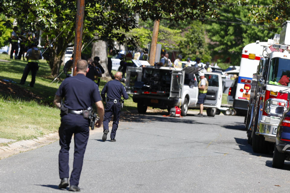 Officers with the Charlotte-Mecklenburg Police Department work in the neighborhood where a shooting took place in Charlotte, North Carolina, April 29, 2024. / Credit: AP Photo/Nell Redmond