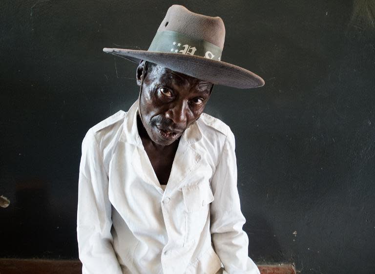 Apolinari Yousters, a 57-year-old fisherman, at a clinic where he gets his ARV's (anti-retrovirals) at Kasensero on the shores of the Lake Victoria in Uganda February 21, 2014