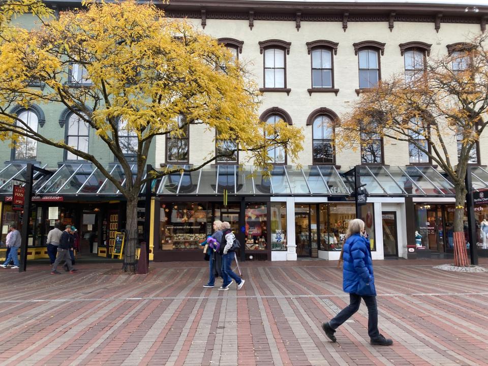 Pedestrians on Church Street pass by Lake Champlain Chocolates on Nov. 11.