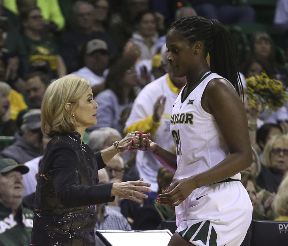 Baylor head coach Kim Mulkey thanks Baylor center Kalani Brown (21) as she head to the bench in the second half of an NCAA college basketball game, Saturday, March 2, 2019, in Waco, Texas. Baylor defeated Oklahoma State 76-44. (AP Photo/Jerry Larson)