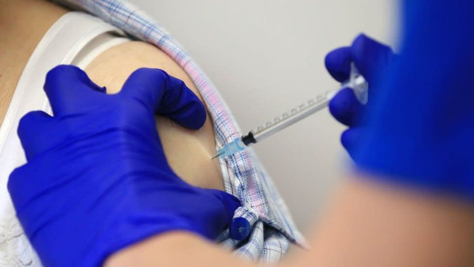 A woman receives the Covid vaccine