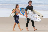 <p>Liam Hemsworth and Gabriella Brooks enjoy an afternoon filled with surfing and sun on Sunday in Byron Bay, Australia. </p>