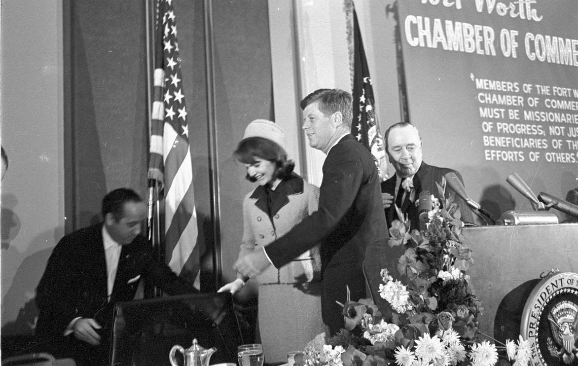 President John F. Kennedy and wife Jacqueline are escorted to seats at a table on the dais, Fort Worth Chamber of Commerce breakfast, Hotel Texas, 11/22/1963