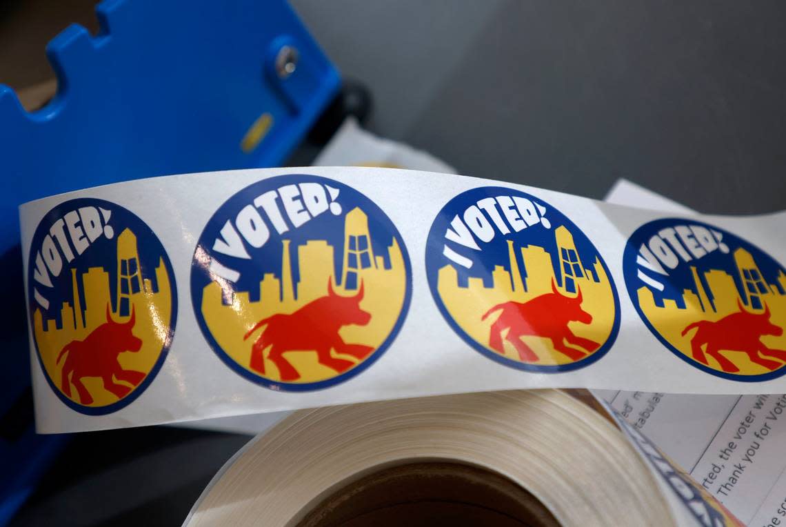 A roll of voting stickers for children sits near the exit of a voting area at the Durham County Main Library on Tuesday, Nov. 8, 2022, in Durham, N.C.
