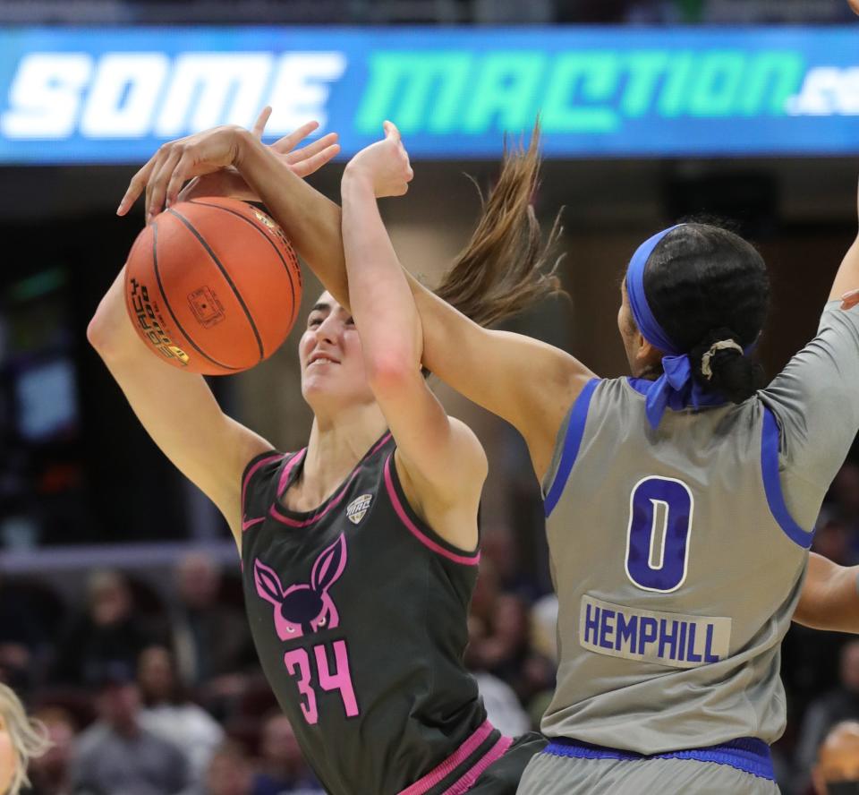 University of Akron forward Reagan Bass has her shot blocked by Buffalo's Summer Hemphill during a Mid American Conference semifinal Friday at Rocket Mortgage FieldHouse. The Bulls won 82-43. [Phil Masturzo/Beacon Journal]