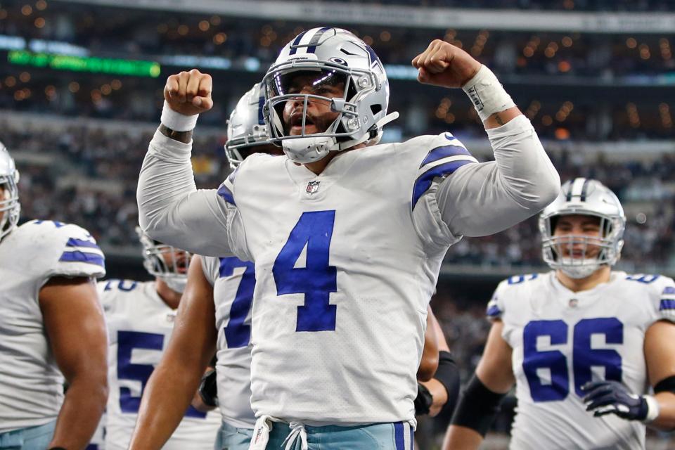 Dallas Cowboys quarterback Dak Prescott celebrates scoring a touchdown against the Atlanta Falcons.