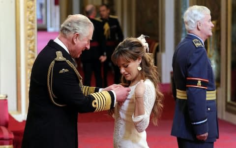 Ms Beneditti receiving her CBA from the Prince of Wales - Credit: Jonathan Brady&nbsp;/PA