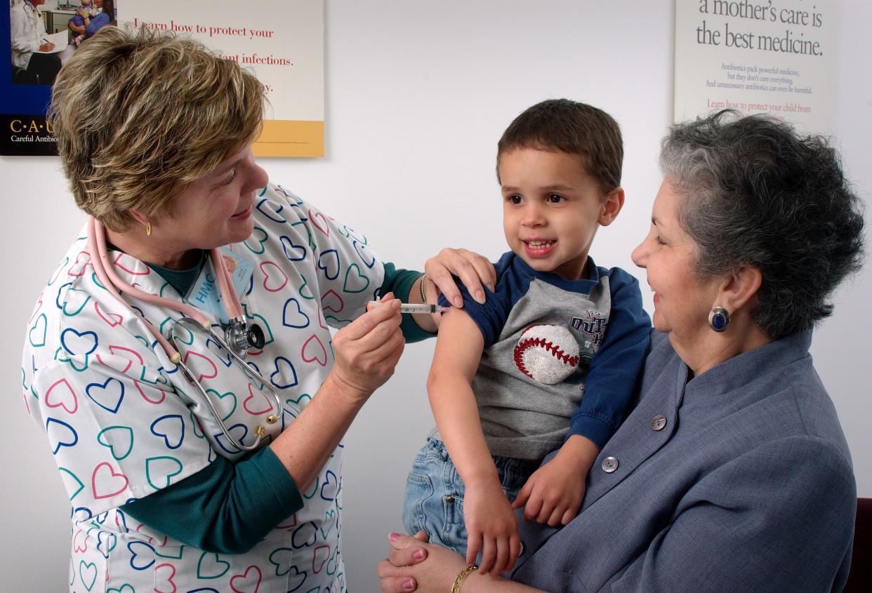 A 3-year-old gets a flu shot while his grandmother looks on.  intramuscular immunization in upper arm.

Vaccinations are most often given via the intramuscular route in the deltoid or thigh muscle, to optimize the immune response of the vaccine and reduce the adverse reactions in and around the injection site. Smaller doses are administered in the deltoid muscle because they are absorbed faster and can cause less pain. Infants and young children should be vaccinated in the anterolateral aspect of the thigh.