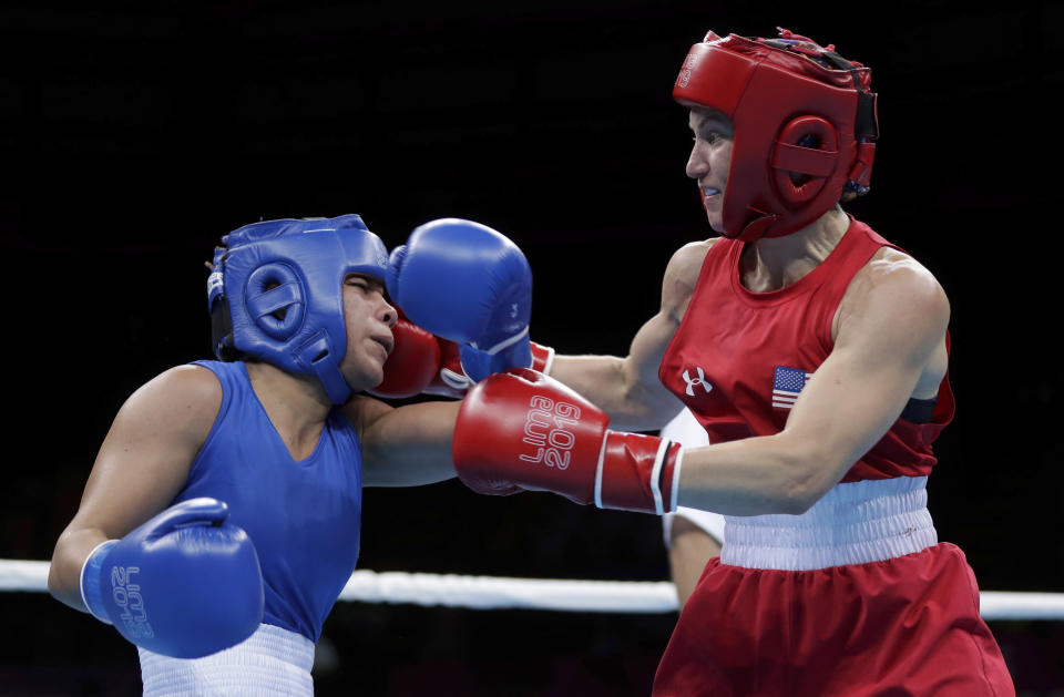 Virginia Fuchs of the United States, right, throws a punch at Irismar Cardozo of Venezuela during the second round of their women's fly, 51 kg boxing semifinal bout at the Pan American Games in Lima, Peru, Tuesday, July 30, 2019. (AP Photo/Fernando Llano)