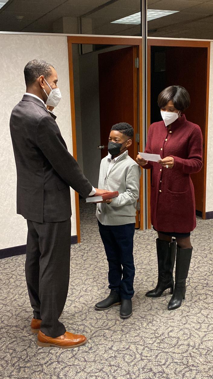 Rochester Mayor Malik Evans was sworn into office at midnight Saturday by his wife Shawanda and eldest son, Cameron, at his campaign offices downtown. The swearing in was done again during his inauguration later in the day at Eastman Theatre.