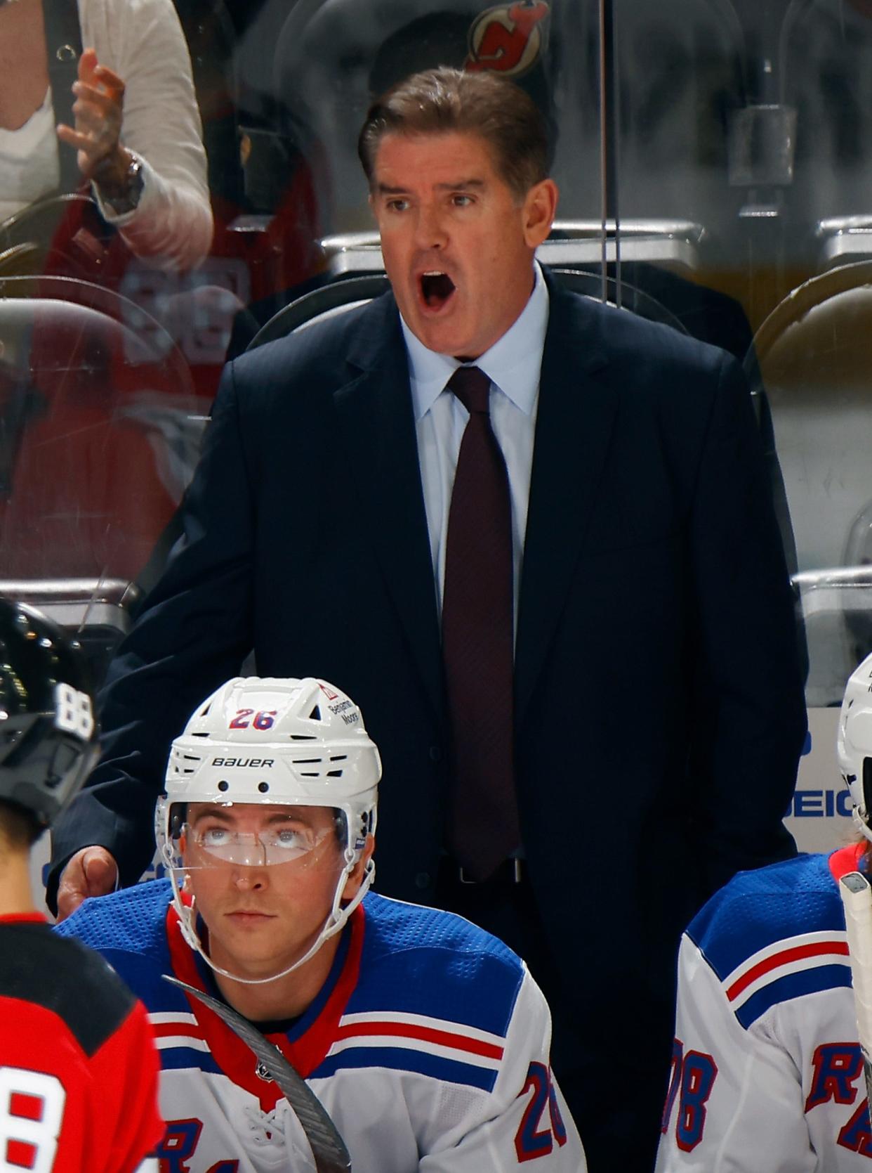 NEWARK, NEW JERSEY - OCTOBER 04: Head coach Peter Laviolette of New York Rangers handles the bench during the game against the New Jersey Devils at Prudential Center on October 04, 2023 in Newark, New Jersey.