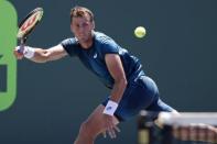 Mar 25, 2018; Key Biscayne, FL, USA; Vasek Pospisil of Canada hits a forehand against Marin Cilic of Croatia (not pictured) on day six of the Miami Open at Tennis Center at Crandon Park. Cilic won 7-5. 7-6(4). Mandatory Credit: Geoff Burke-USA TODAY Sports