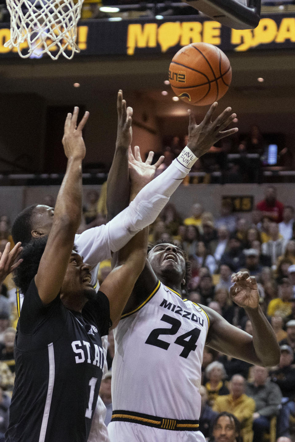 Missouri's Kobe Brown, right, and Mississippi State's Tolu Smith, left, reach for a rebound during the first half of an NCAA college basketball game Tuesday, Feb. 21, 2023, in Columbia, Mo. (AP Photo/L.G. Patterson)