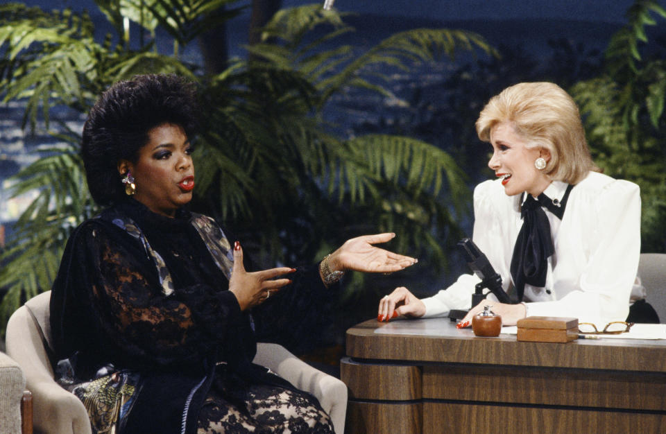 Oprah Winfrey (left) during an interview with guest host Joan Rivers on 