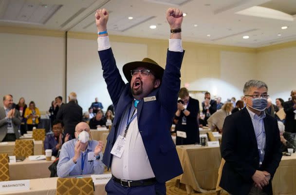 PHOTO: Manny Crespin, Vice Chair of the Democratic Party of New Mexico cheers after a vote at the DNC Winter Meeting on its Rules and Bylaws Committees recommendation to reorder the presidential primary calendar in 2024, in Philadelphia, on Feb. 4, 2023. (Timothy A. Clary/AFP via Getty Images)