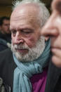 Former French priest Bernard Preynat arrives at the Lyon court house, central France, Monday Jan.13, 2020. Bernard Preynat, is accused of sexually abusing some 75 Boy Scouts went on trial Monday _ but the proceedings were delayed until Tuesday because of a strike by lawyers. Preynat admitted in the 1990s to abusing boys, but was only removed from the priesthood last year. (AP Photo/Laurent Cipriani)