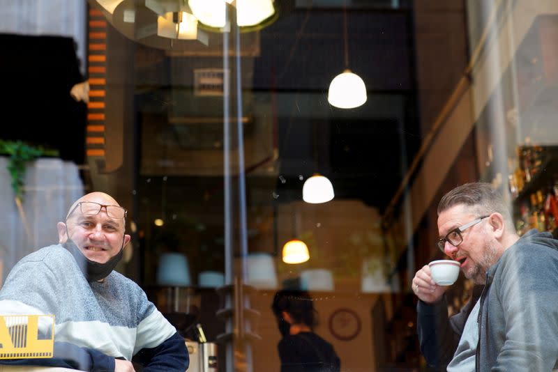 Johnny Vakalis poses for a portrait at his cafe after the coronavirus disease (COVID-19) restrictions were eased for the state of Victoria, in Melbourne