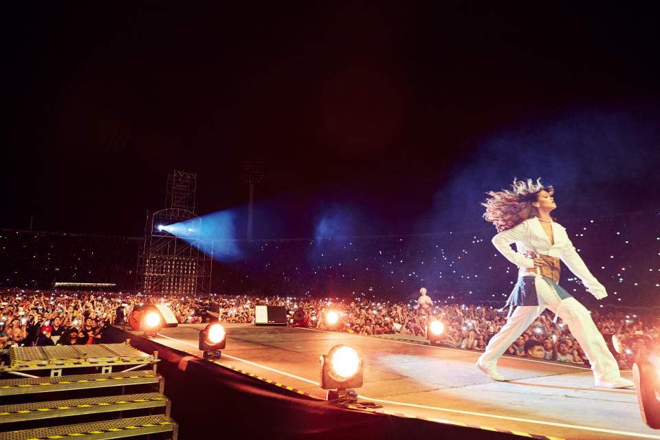 Rihanna on stage in white – Estadio Nacional, Santiago, Chile, 2015. Photograph: Dennis Leupold (pages 6-7)