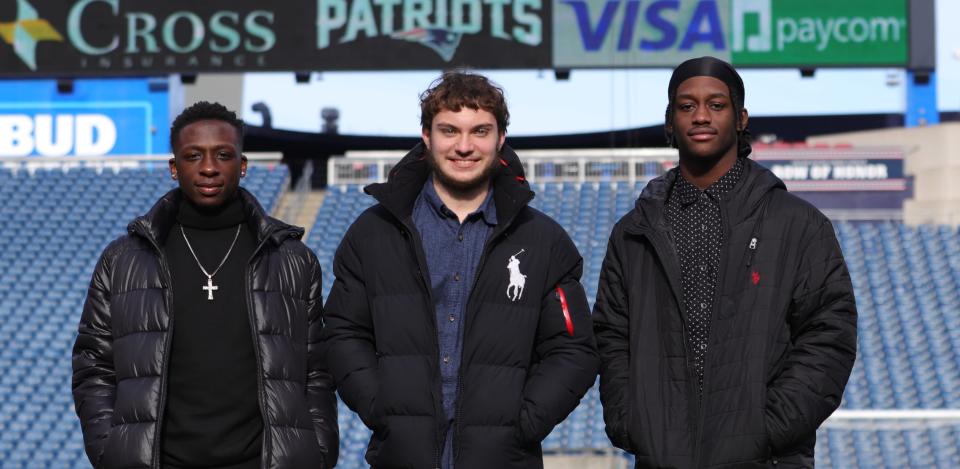 Randolph's Malik White, from left, Paul Goggin and Gardy Augustin at the MIAA state championship breakfast at Gillette Stadium on Tuesday, Nov. 23, 2021.